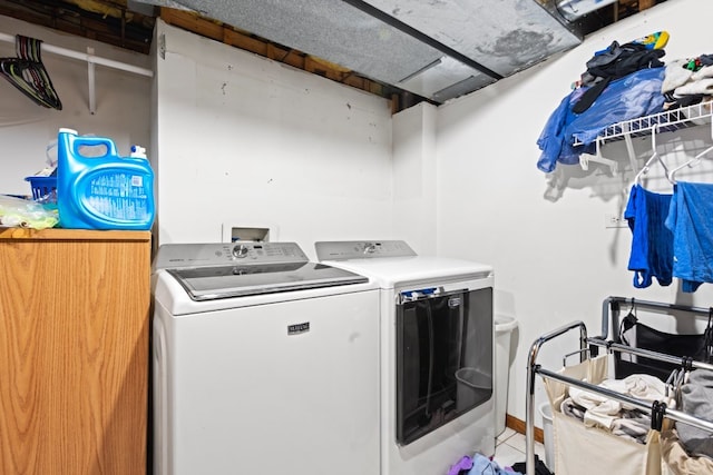 laundry room with separate washer and dryer