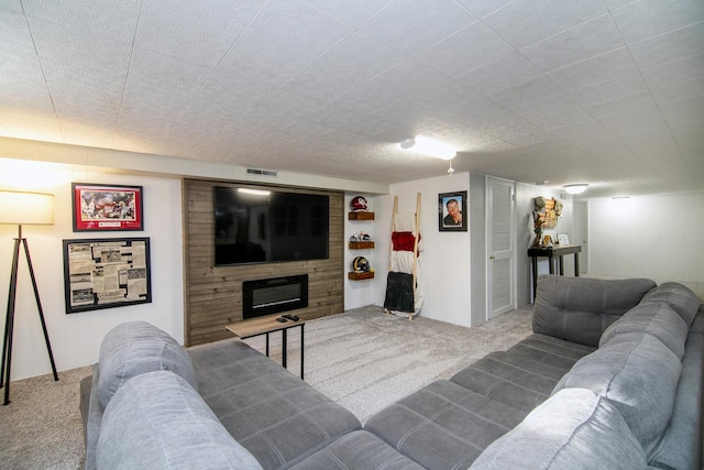 living room featuring carpet floors and a textured ceiling