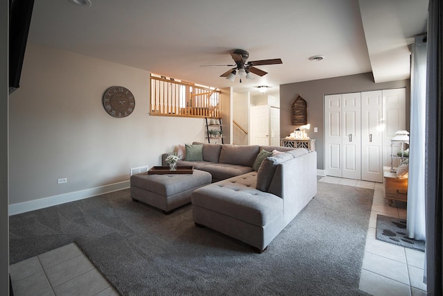 tiled living room with ceiling fan