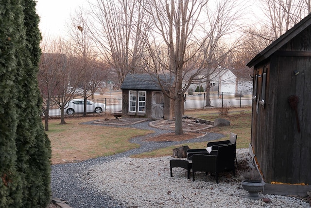 yard at dusk with a storage unit