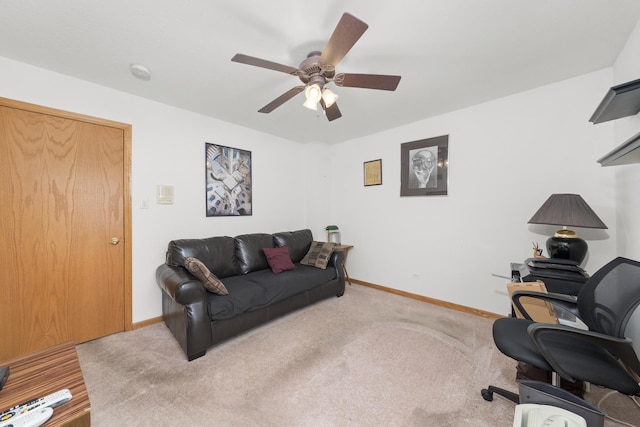 living room with ceiling fan and carpet flooring