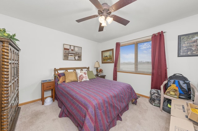 bedroom featuring ceiling fan and light colored carpet