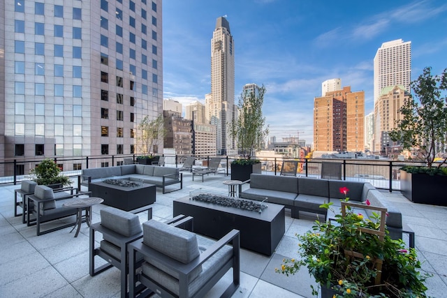 view of patio / terrace featuring an outdoor living space with a fire pit