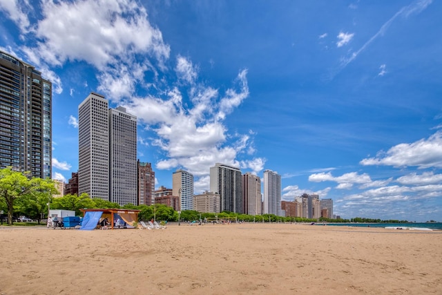 view of home's community featuring a view of the beach and a water view