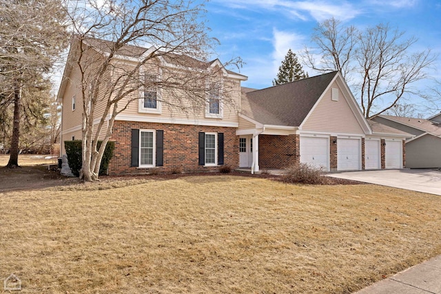 view of front property with a garage and a front yard