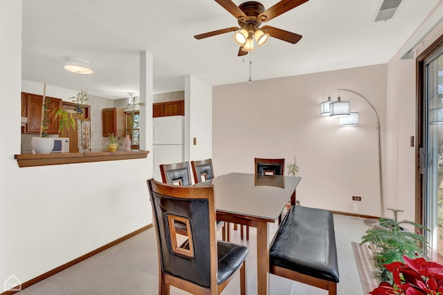 dining room with ceiling fan