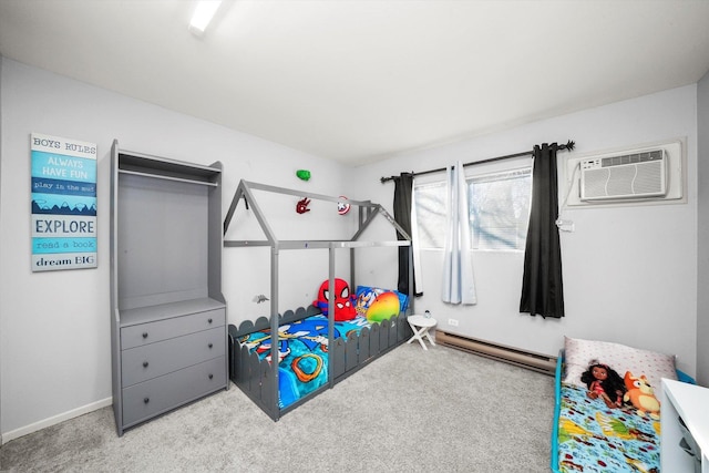 bedroom with a baseboard heating unit, a wall unit AC, and carpet