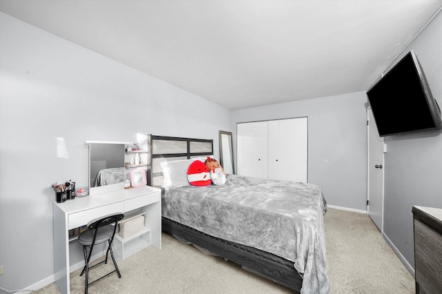 bedroom featuring carpet and a closet