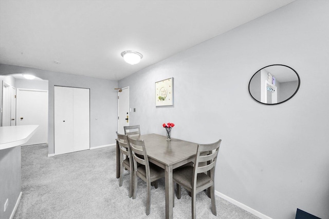 view of carpeted dining area