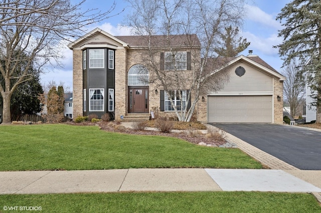 view of front of property with a garage, a front lawn, aphalt driveway, and brick siding