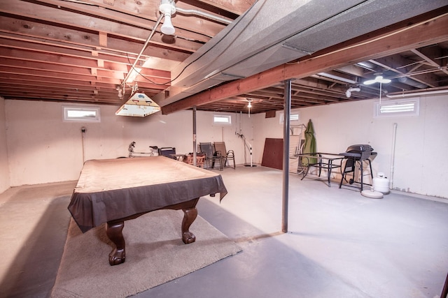 game room featuring concrete flooring and a healthy amount of sunlight