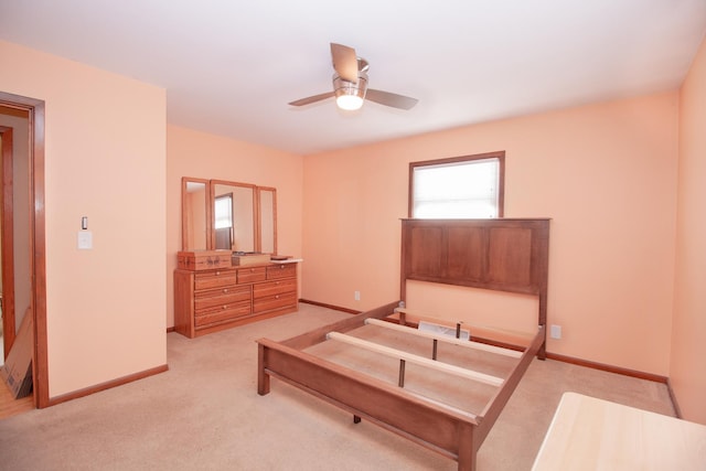 bedroom featuring ceiling fan and light colored carpet