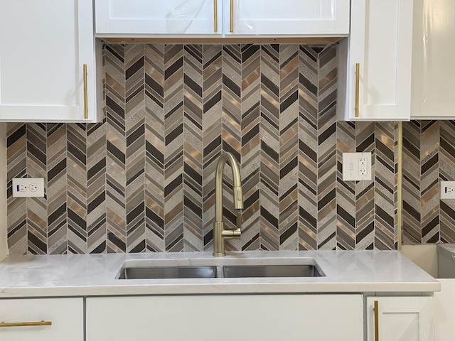 room details with white cabinetry and sink