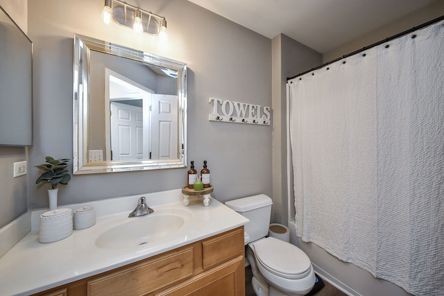 full bathroom with vanity, toilet, and shower / bath combo with shower curtain