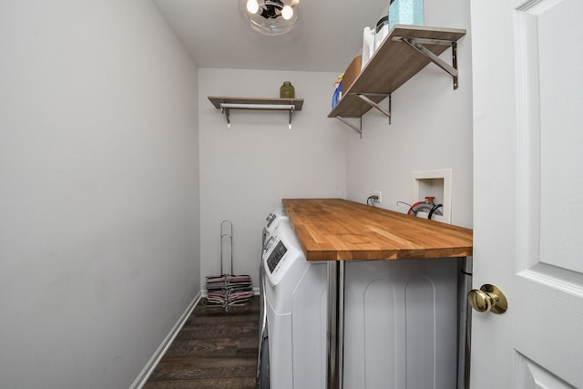 laundry area featuring dark hardwood / wood-style floors and separate washer and dryer