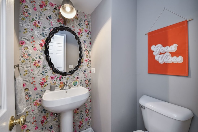 bathroom featuring sink and toilet