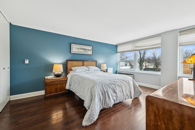 bedroom featuring dark hardwood / wood-style flooring