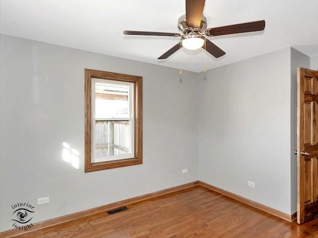 unfurnished room featuring ceiling fan and hardwood / wood-style floors