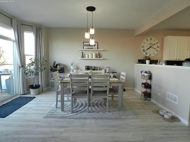 dining space featuring light hardwood / wood-style floors