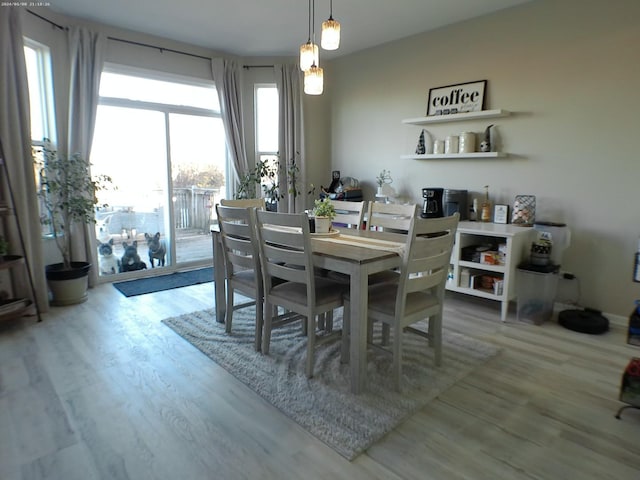 dining space with light wood-type flooring