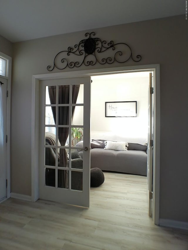 doorway featuring french doors and light wood-type flooring