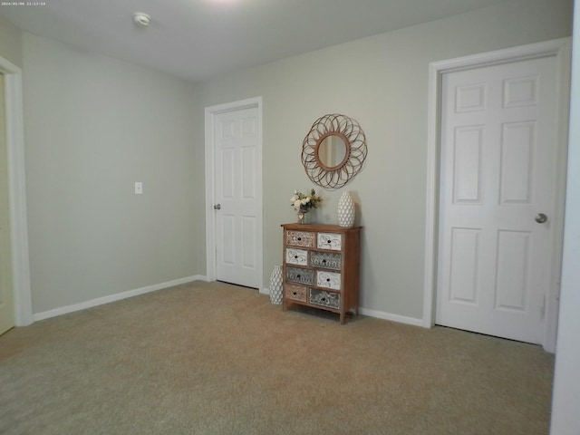 unfurnished bedroom with light carpet