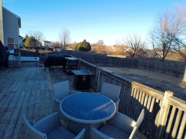 wooden terrace featuring a hot tub