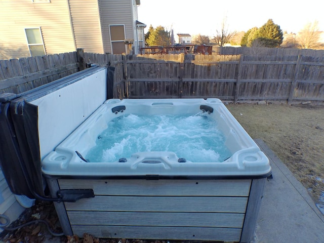 view of patio / terrace with a hot tub