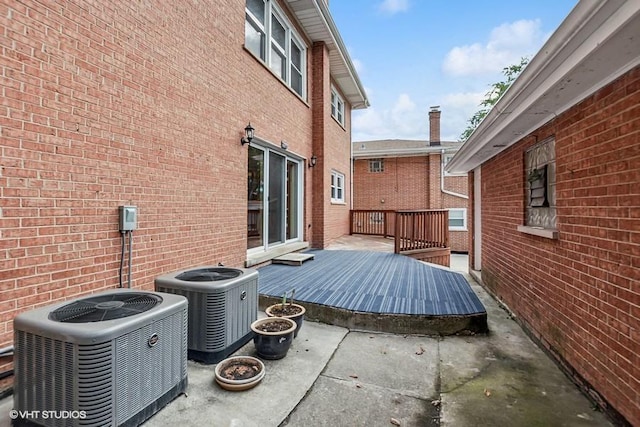 view of patio / terrace featuring a deck and central air condition unit