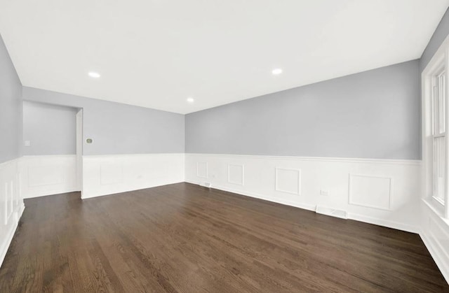 spare room featuring dark hardwood / wood-style flooring