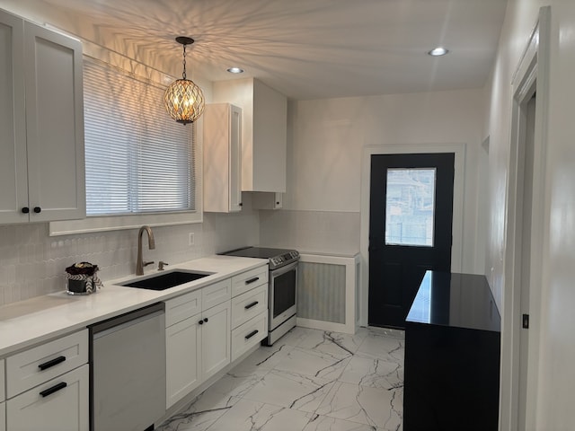 kitchen with stainless steel electric range oven, white cabinetry, sink, dishwashing machine, and hanging light fixtures