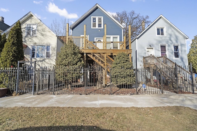 back of house featuring a wooden deck