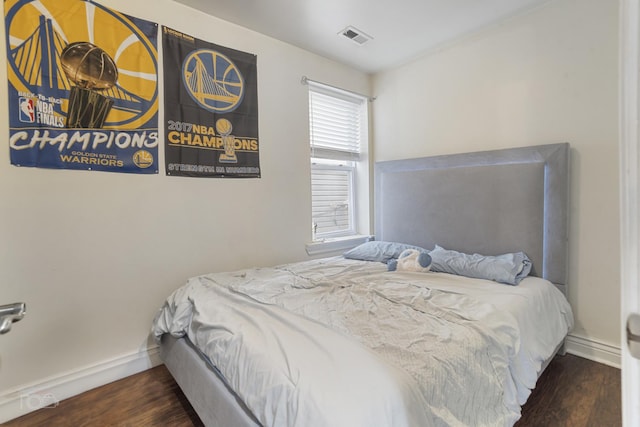 bedroom featuring dark wood-type flooring