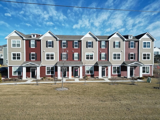 view of property featuring a front yard