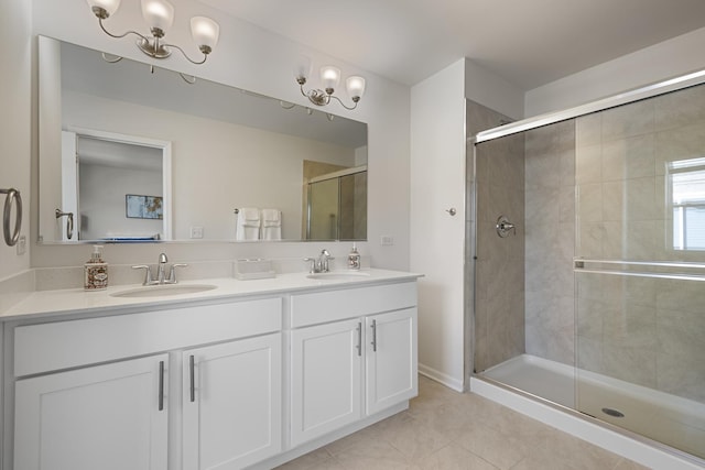 bathroom featuring vanity, an enclosed shower, and tile patterned floors