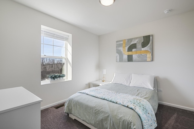 bedroom with dark carpet