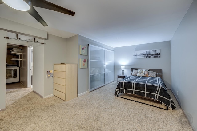 bedroom with washer / clothes dryer, carpet floors, and ceiling fan