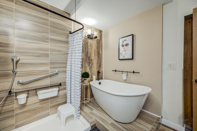 bathroom featuring separate shower and tub