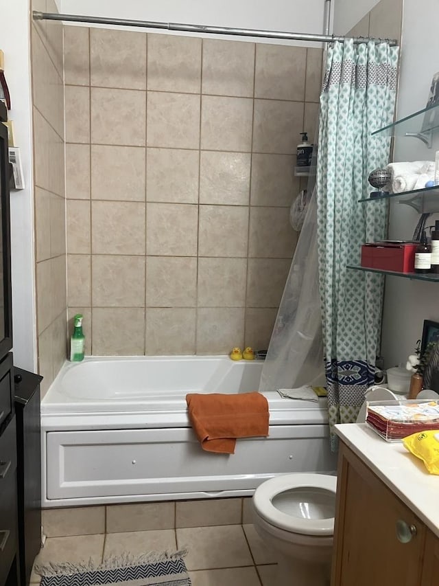 full bathroom with vanity, shower / tub combo with curtain, tile patterned floors, and toilet