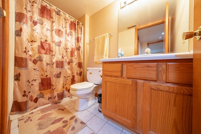 bathroom with walk in shower, vanity, toilet, and tile patterned flooring