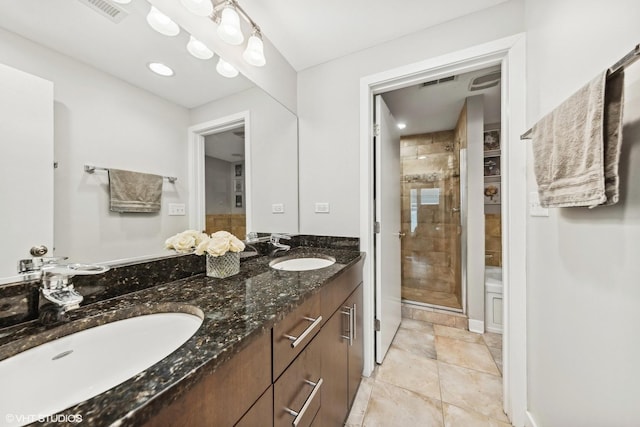 bathroom with vanity and an enclosed shower