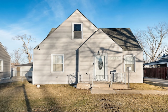 back of property featuring a yard