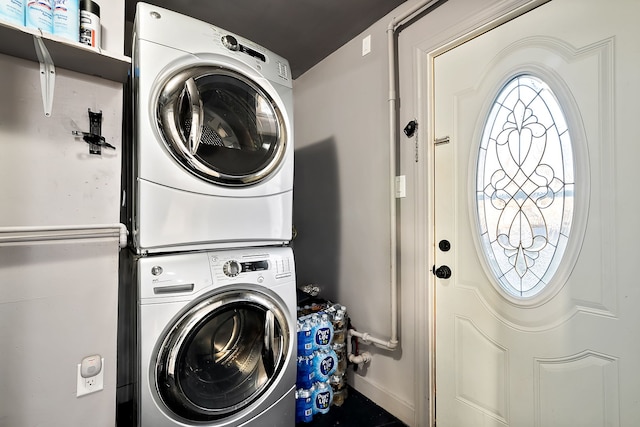 washroom with stacked washer and dryer