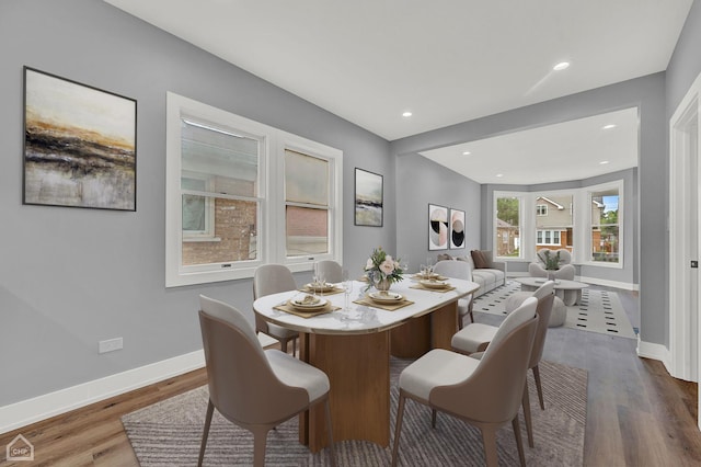 dining area with wood-type flooring