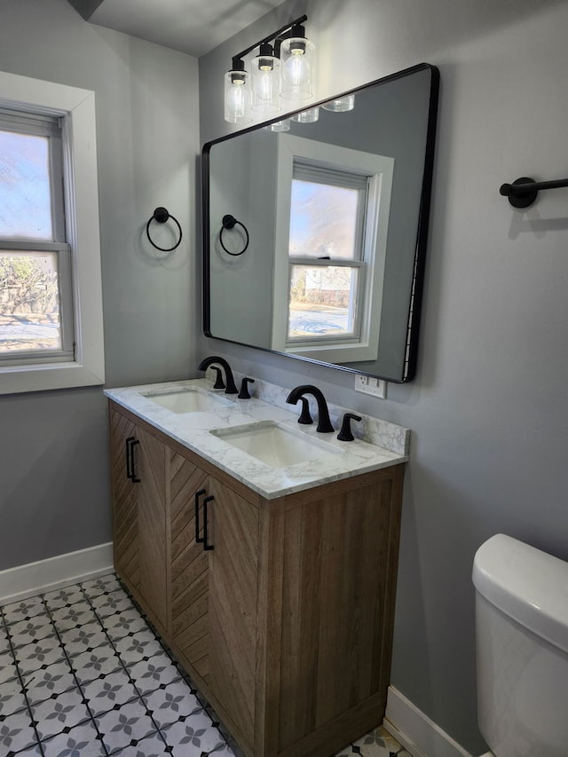 bathroom with vanity and toilet