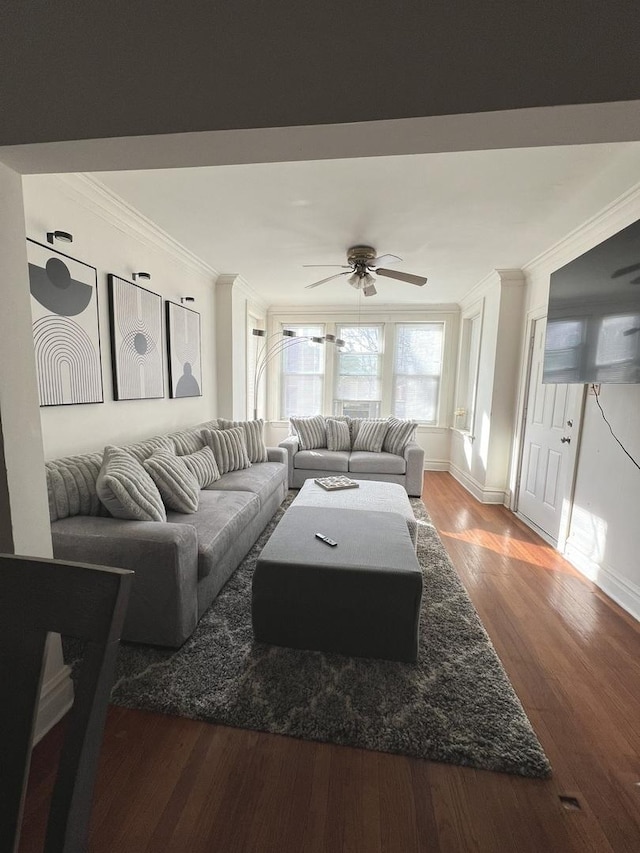 living room featuring hardwood / wood-style flooring, ceiling fan, and ornamental molding