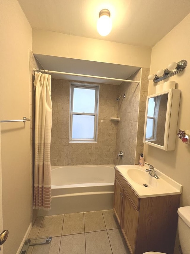 full bathroom featuring shower / tub combo with curtain, vanity, tile patterned floors, and toilet