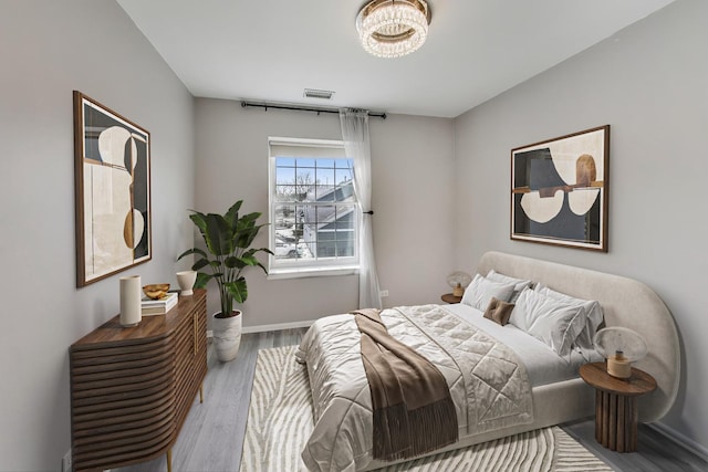 bedroom featuring wood-type flooring