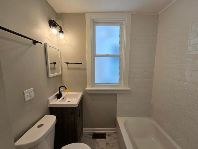 bathroom featuring baseboards, toilet, vanity, marble finish floor, and shower / bathtub combination