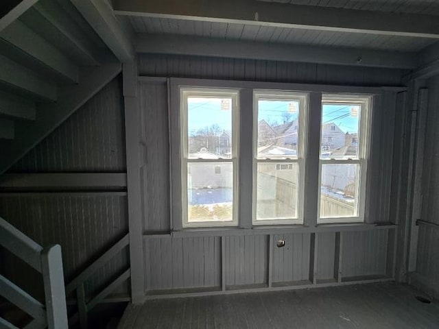 interior space with beamed ceiling and wood finished floors